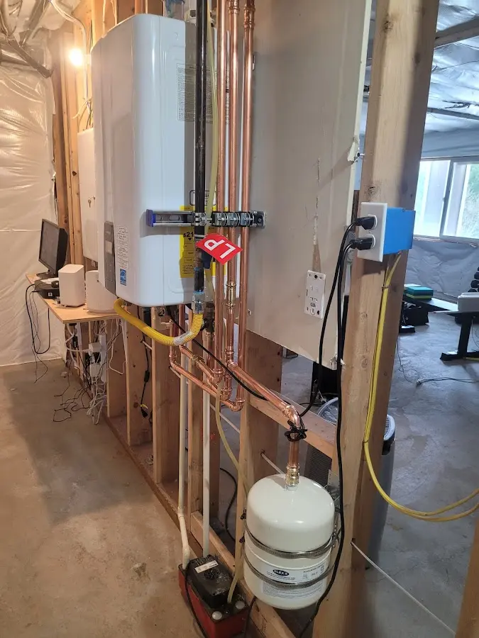 Licensed plumber repairing a kitchen sink in Cambridge